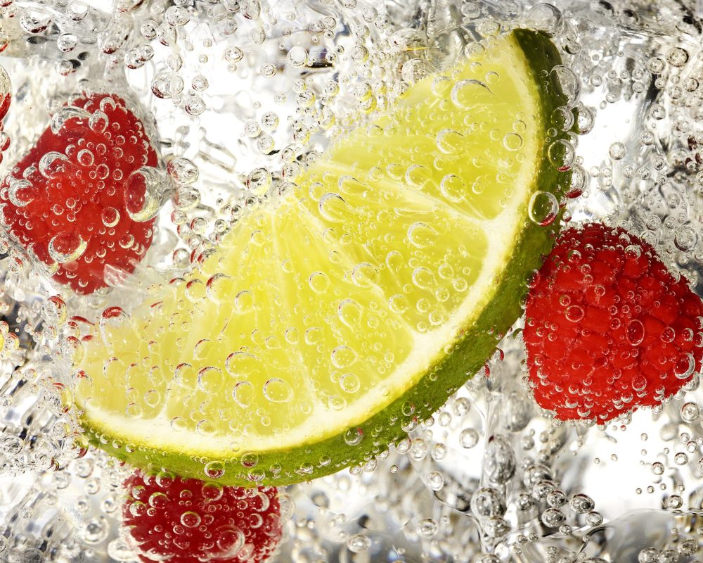 Lime and raspberries splash photo by Jens Johnson Photography. Premium food, beverage, and product photography for Connecticut and New York.