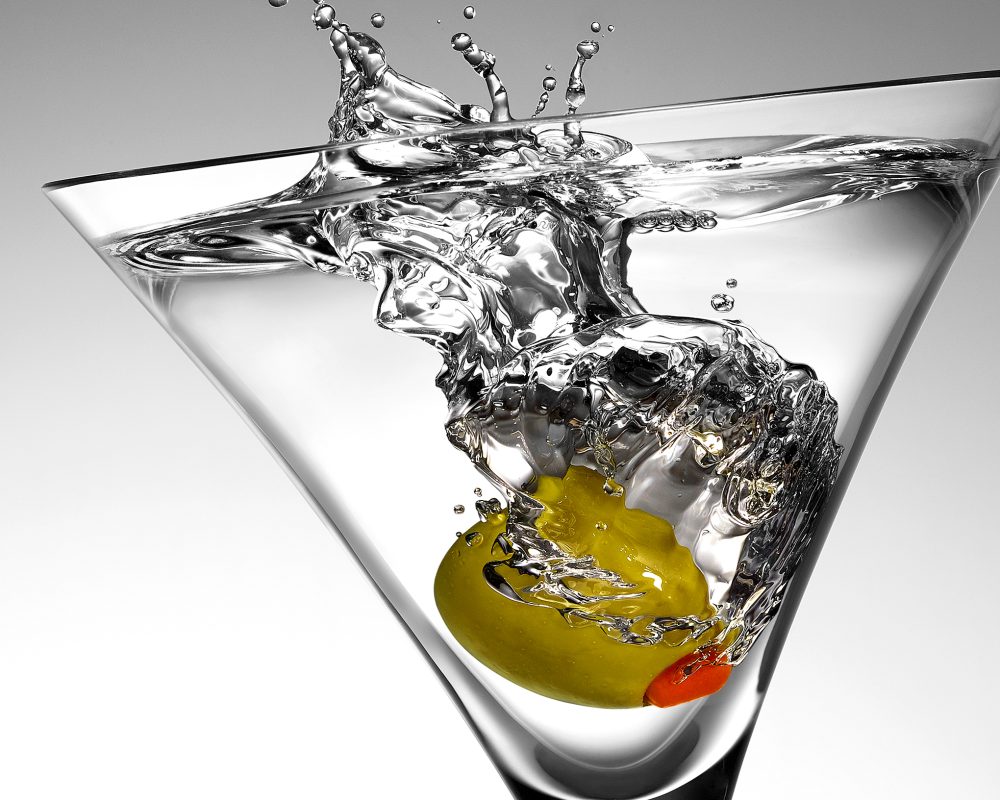 Martini Olive Drop in a glass photo by Jens Johnson Photography. Premium food, beverage, and product photography for Connecticut and New York.
