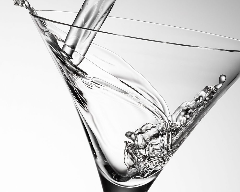 Martini pour in a glass photo by Jens Johnson Photography. Premium food, beverage, and product photography for Connecticut and New York.